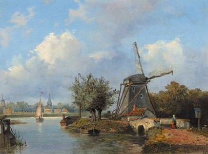 A windmill along a canal with a town in the distance