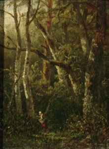 A woman picking berries in the woods