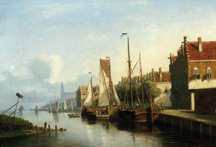 Sailingvessel along a quay, a church towering in the distance