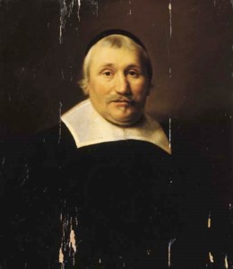 Portrait of a parson, half length, wearing black costume with lace collar and black cap