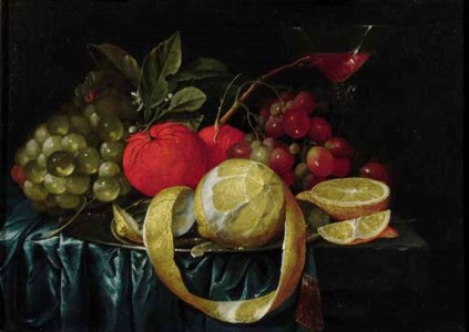 A peeled lemon, oranges, grapes on a pewter plate, and a Façon-de-Venice wineglass on a draped table