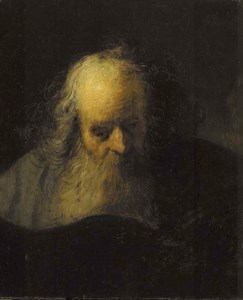 An old man reading a book
