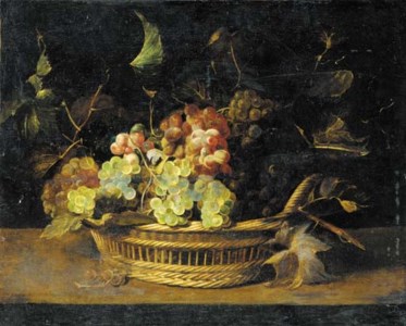 Bunches of grapes in a basket on a ledge