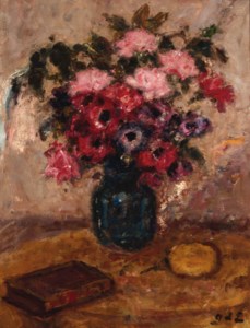 Roses and anemonies in a vase on a table