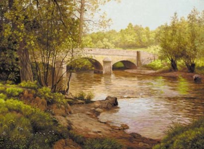 A wooded river landscape with a bridge beyond