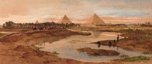 A camel train with the pyramids beyond