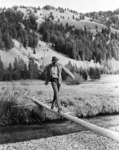 Gary Cooper crossing the river during a hunting trip with Ernest Hemingway, Sun Valley, Idaho