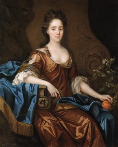 Portrait of Frances Wiat, three-quarter-length, seated, in an ochre dress and blue wrap, holding an orange in her left hand, her right arm resting on a plinth, before a draped curtain