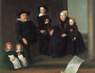 Group portrait of a gentleman and his wife, full-length, and their four children on a terrace