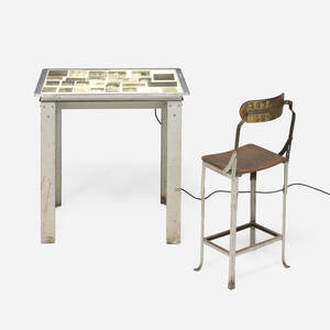 Illuminated slide table with chair and collection of vintage glass plates
