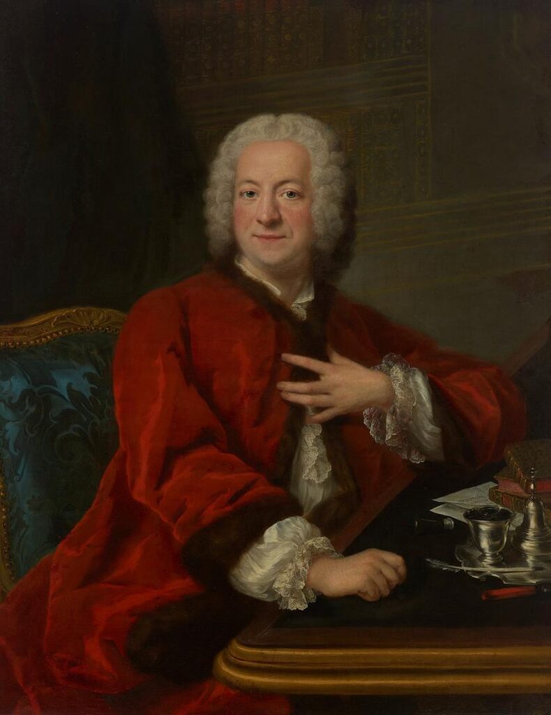 Portrait of a gentleman, half length, seated at a desk in a library