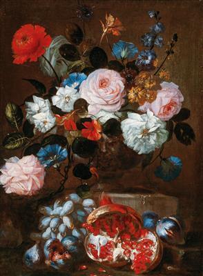 Flowers in a vase with grapes and a pomegranate