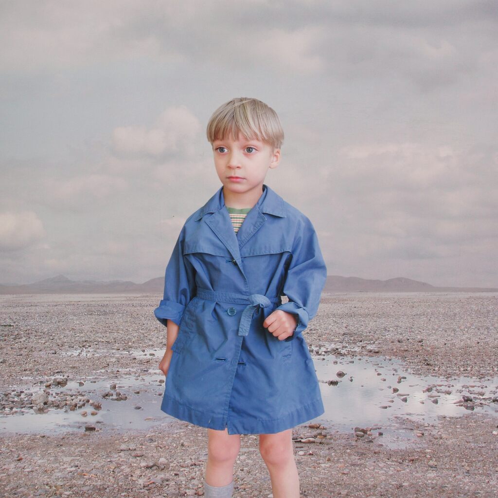 Boy in a blue raincoat 2