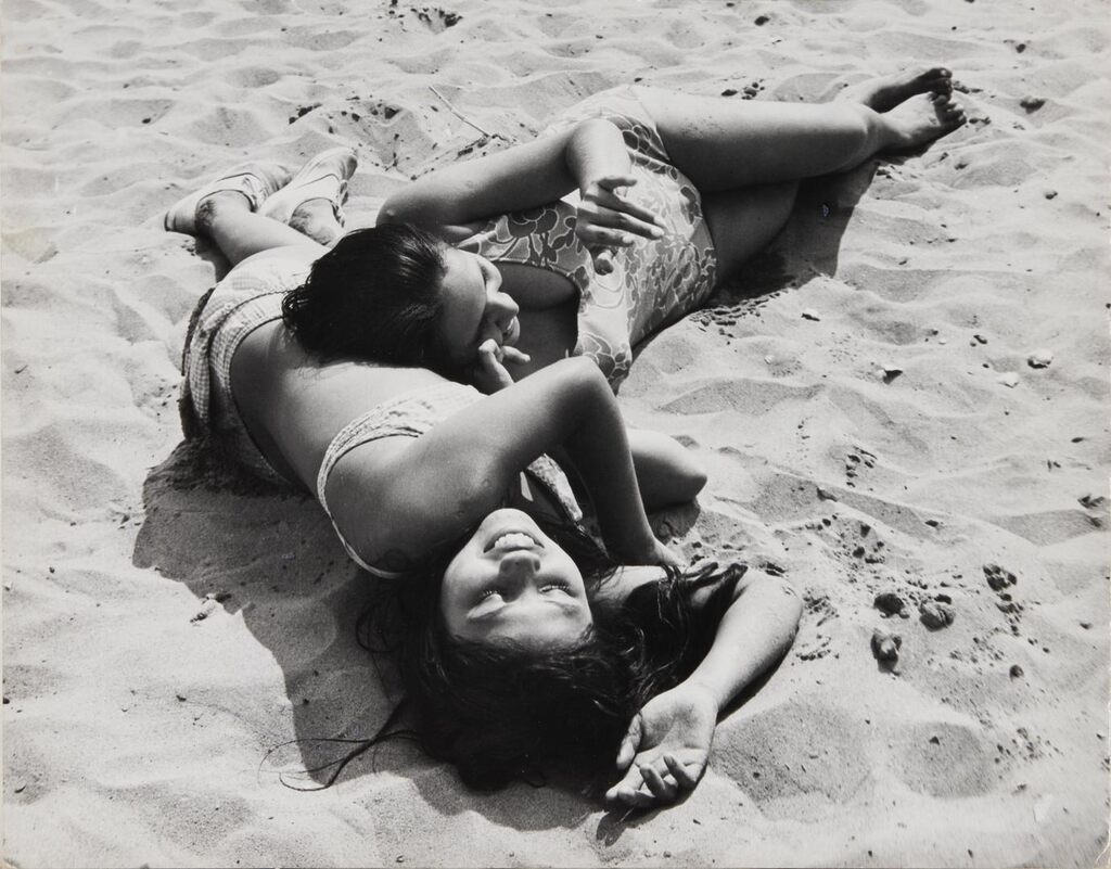 Untitled [two girls lying on the beach, Coney Island, Brooklyn]