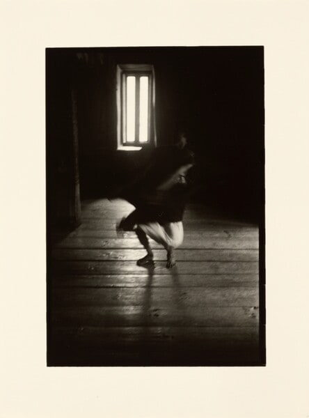 [Blurry figure in white]