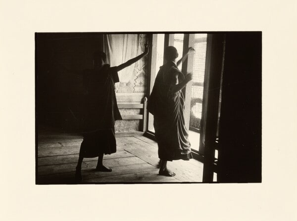 [Two figures dancing]