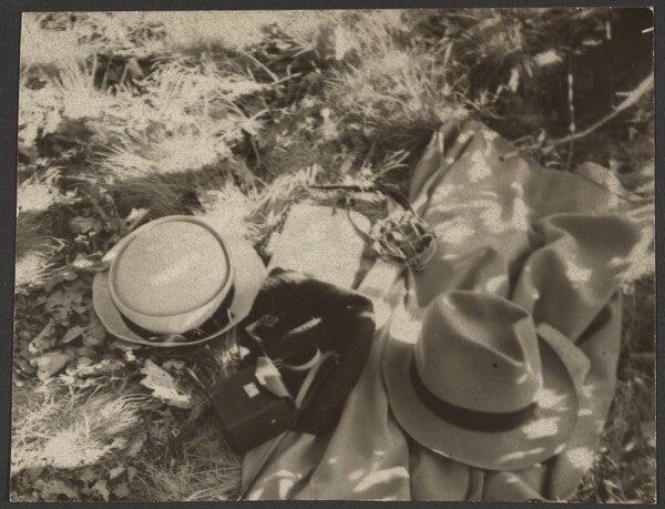 [Hats and coat in grass]