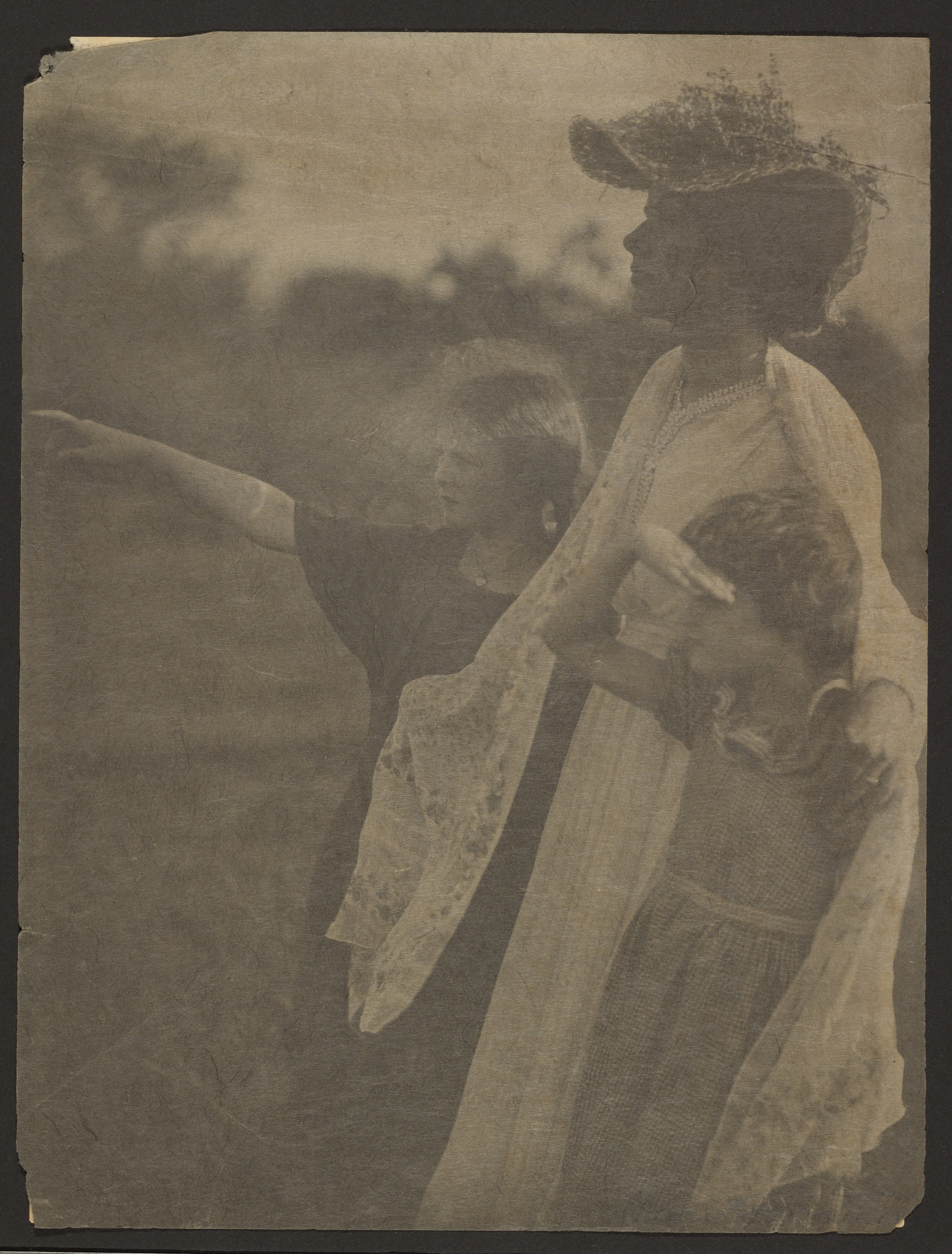 [Woman and two children]
