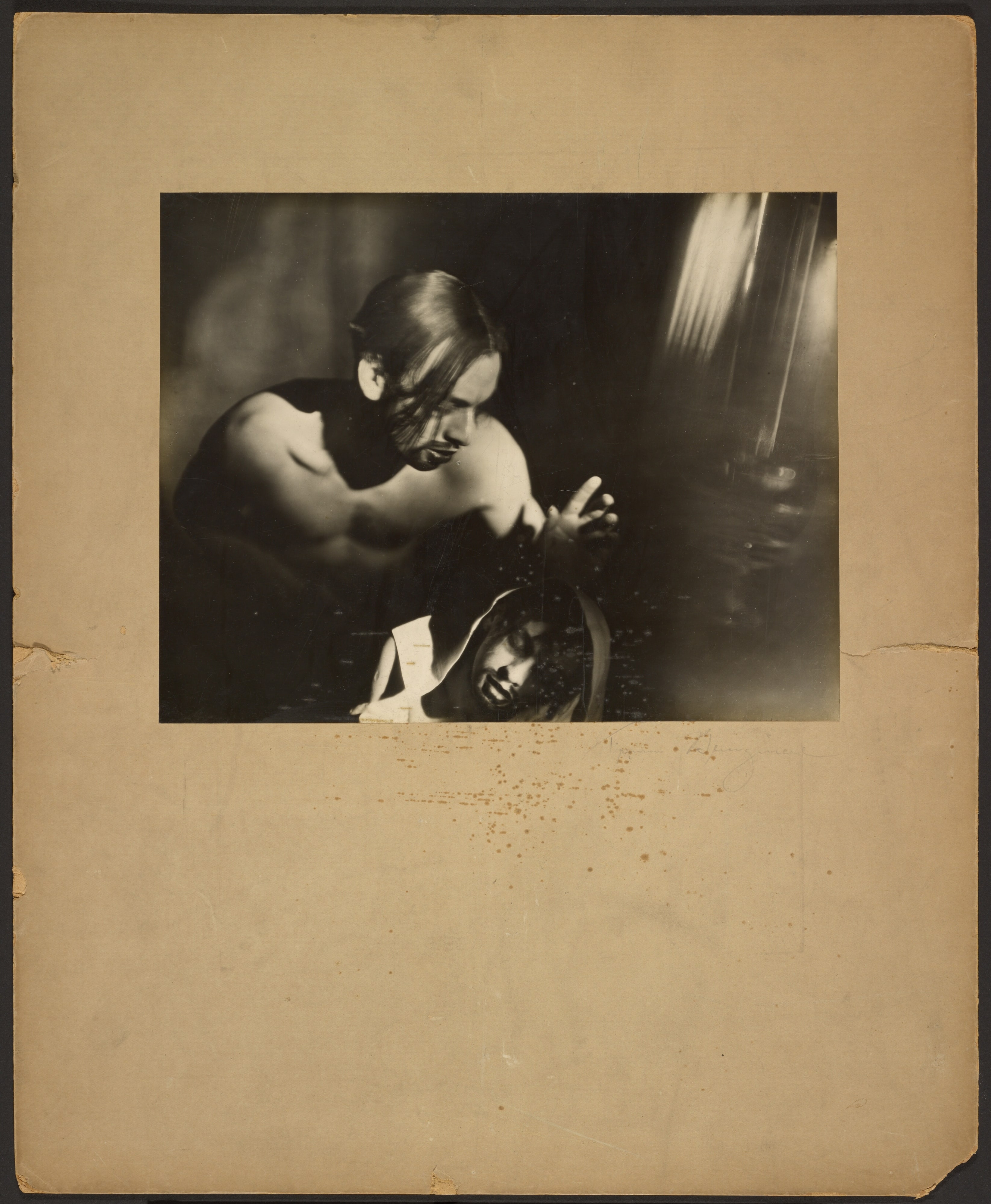 [Bare-Chested Man Hovering Over a Man in a Hooded Outfit]