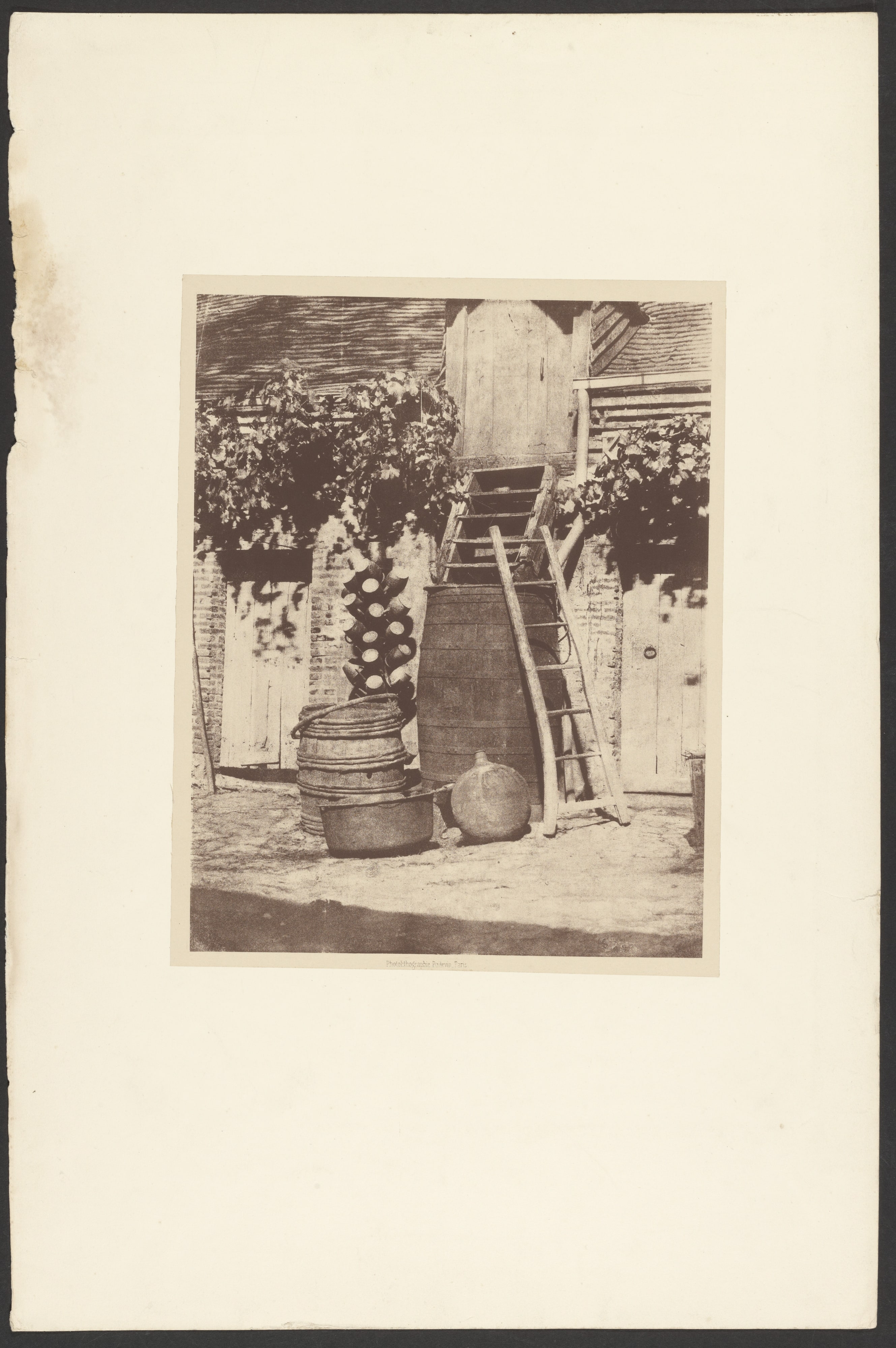 [Ladder leaning on barrel]