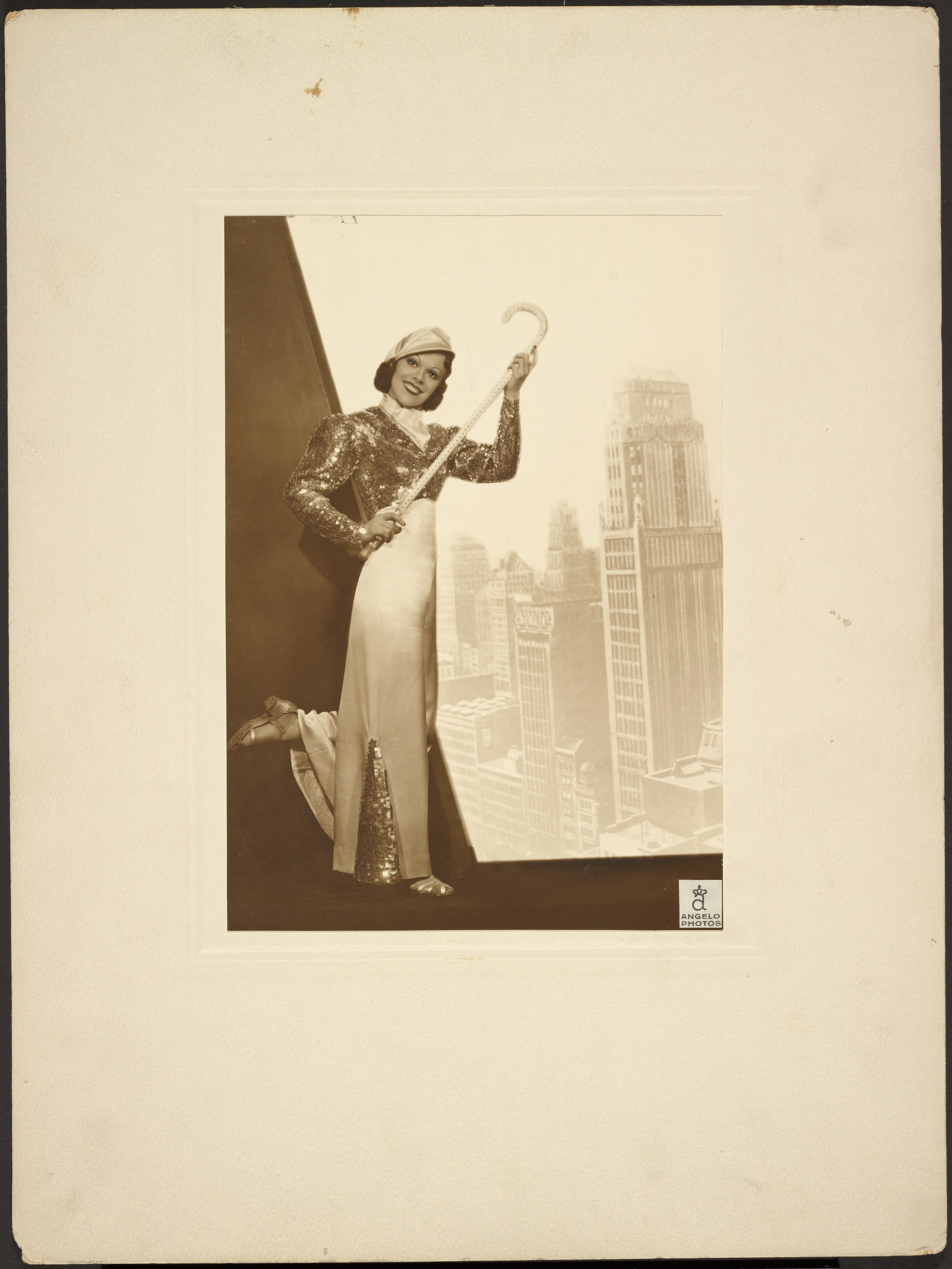 [Portrait of woman and city skyline]