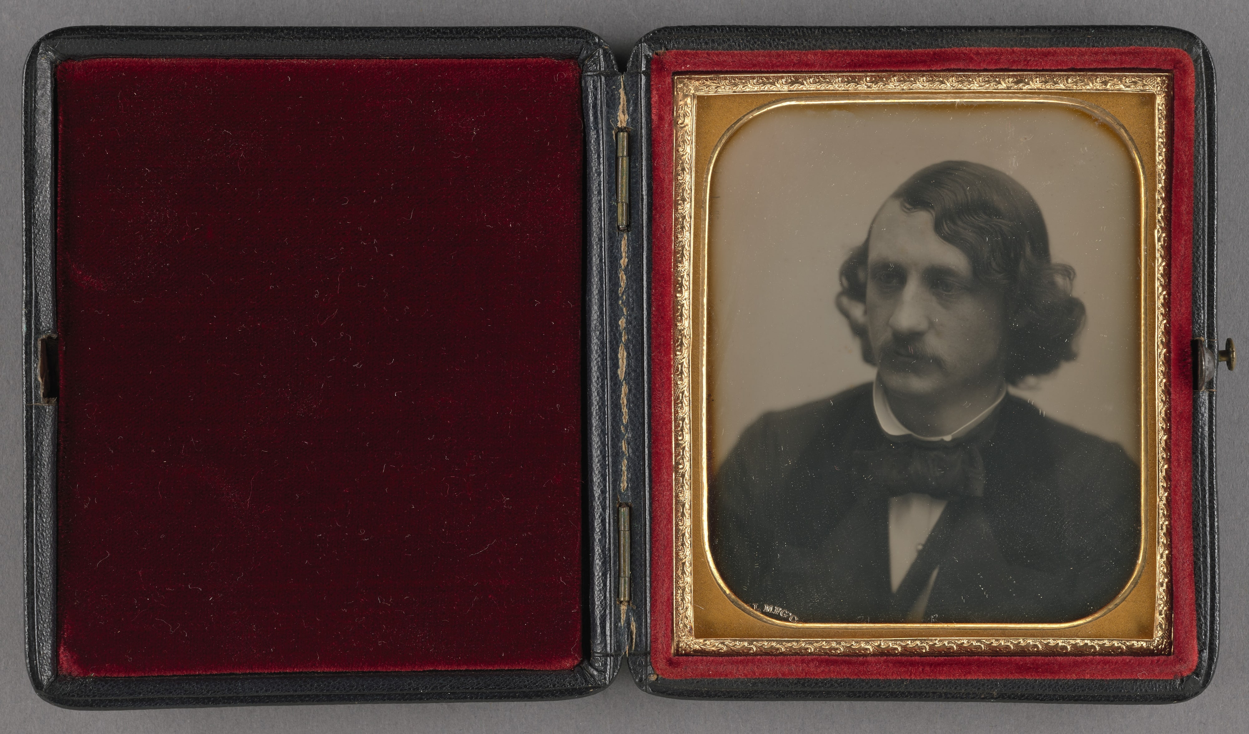 [Portrait of a young man with moustache and long hair] / [M. T. Cushing]