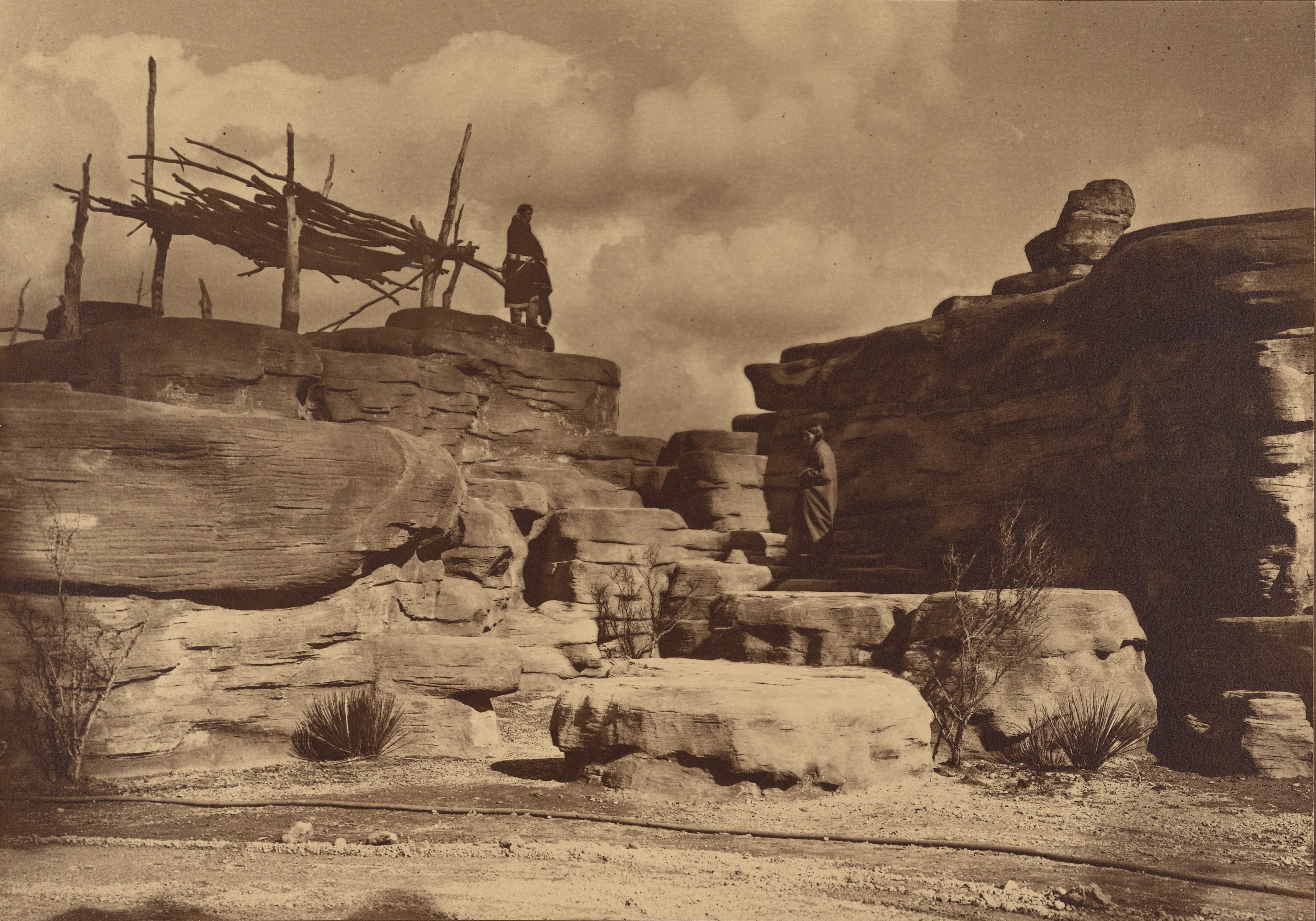 [Figure on Rocks with Shelter]