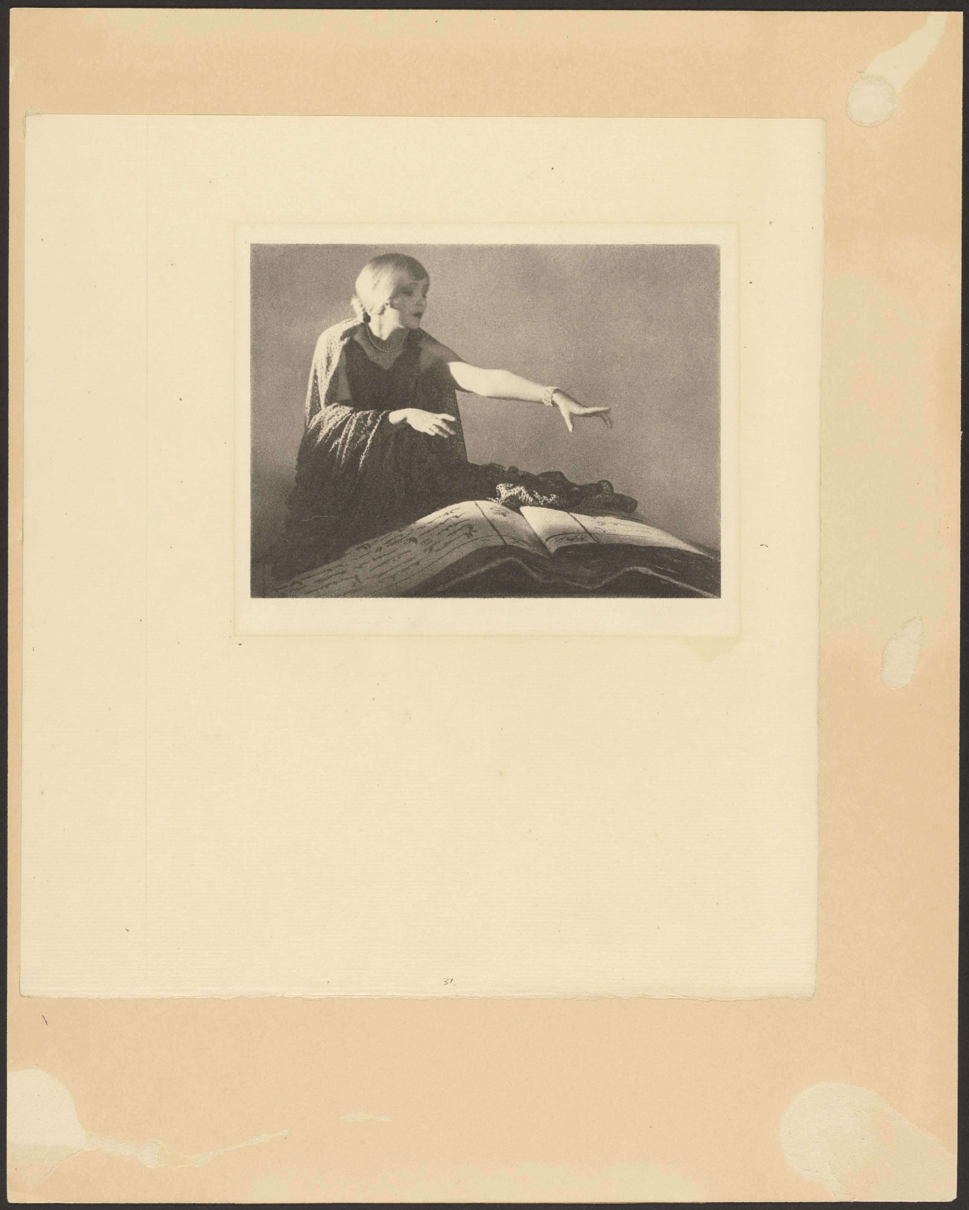 [Woman Reaching Out Over a Large Book]