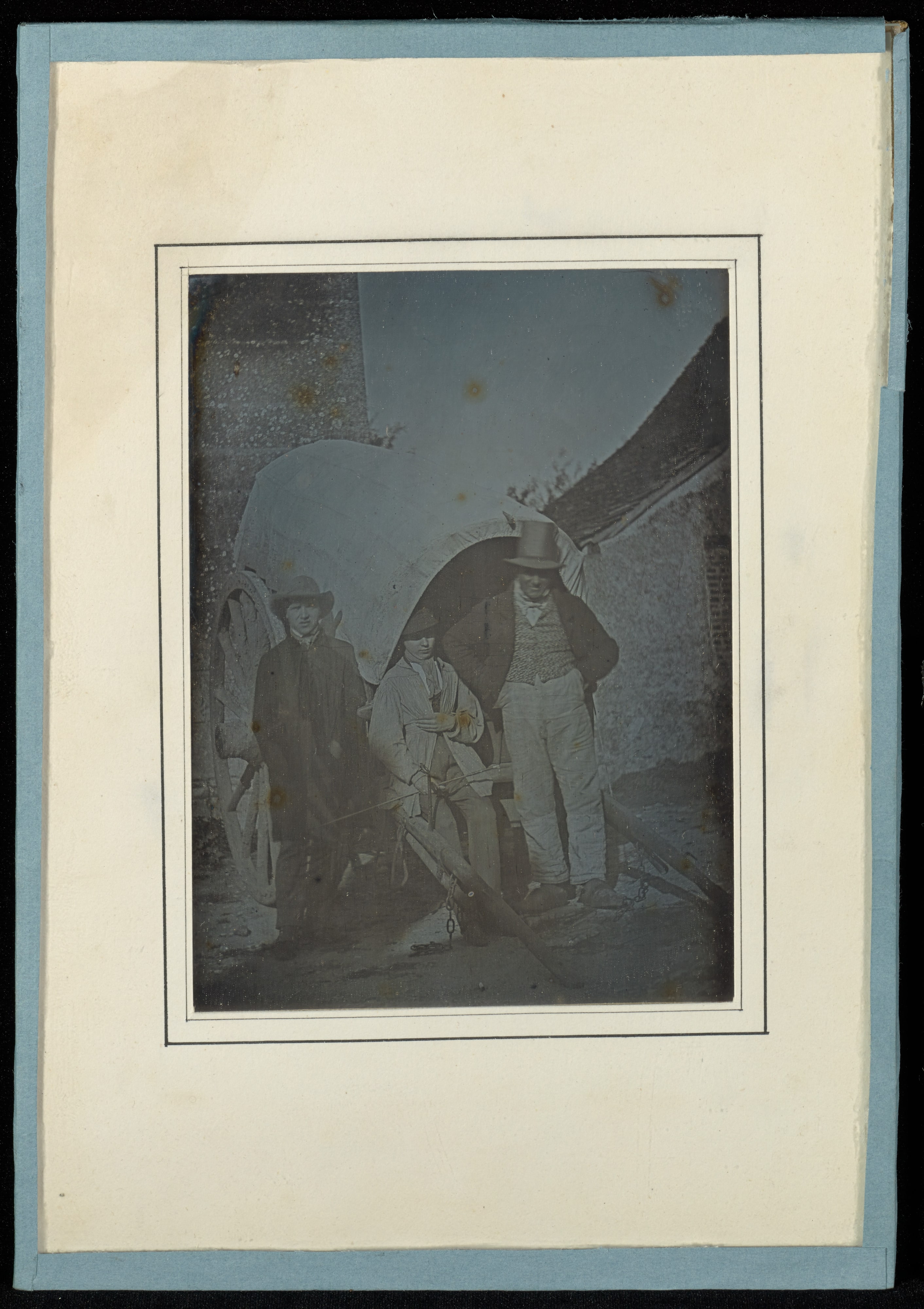 [Portrait of Two Boys and a Man]