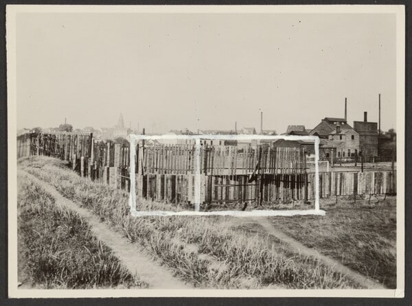 [Wooden Fence at Outskirts of City]
