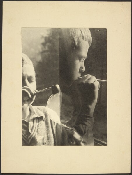[Two Views of Child Blowing Soap Bubble]