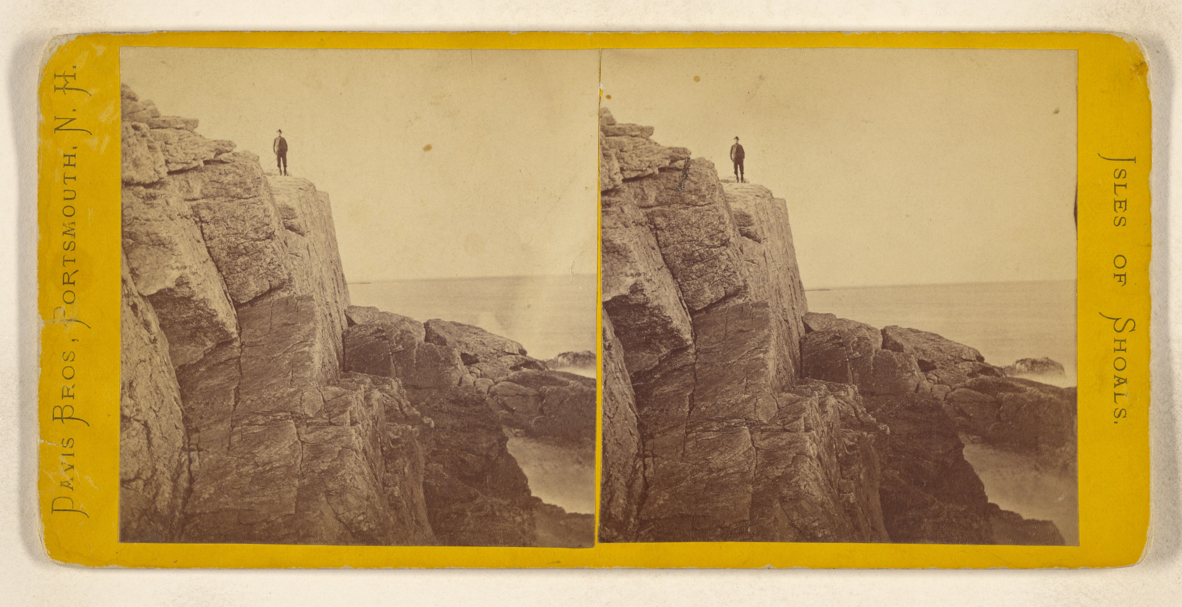 Isles of Shoals. [Man standing at edge of cliff]