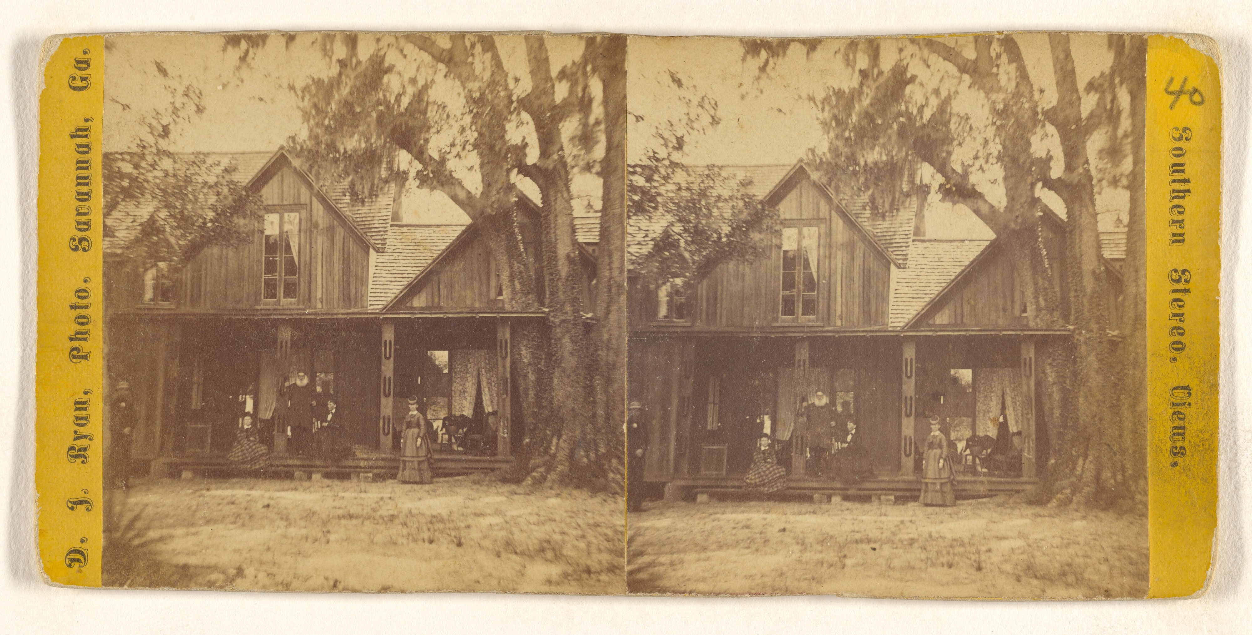[Family in fine dress posed on or near front porch of house, Savannah, Georgia]