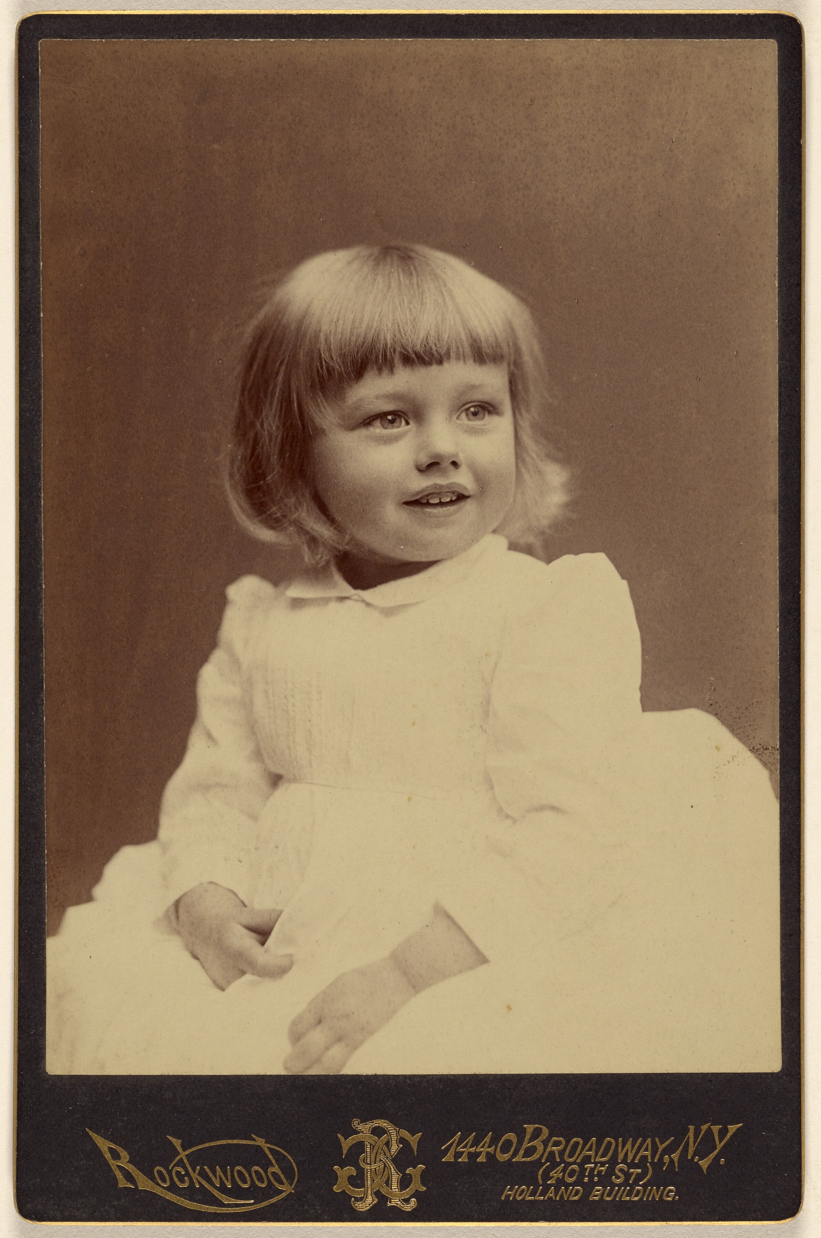 [Unidentified little girl, seated]