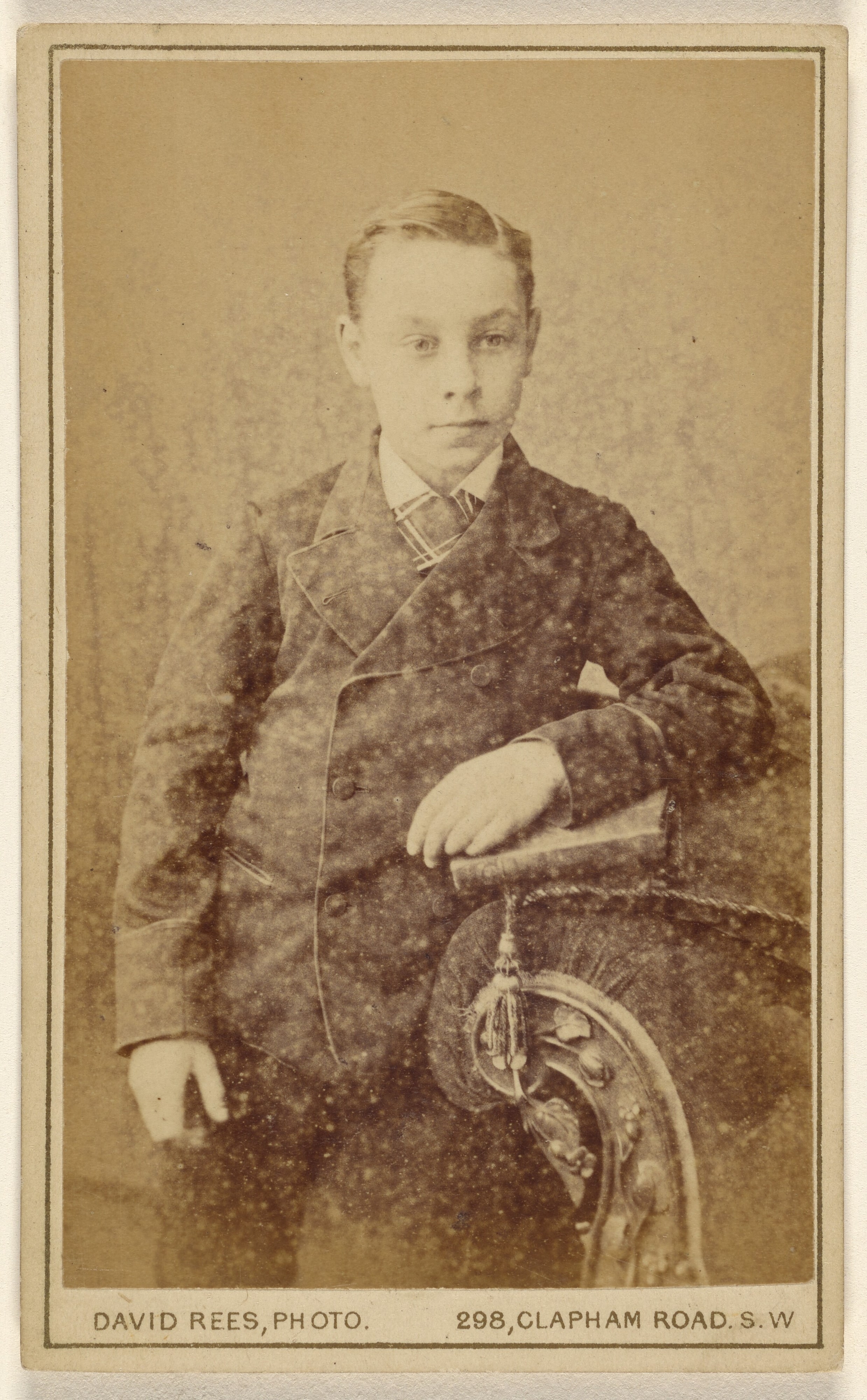 [Unidentified well-dressed young boy]
