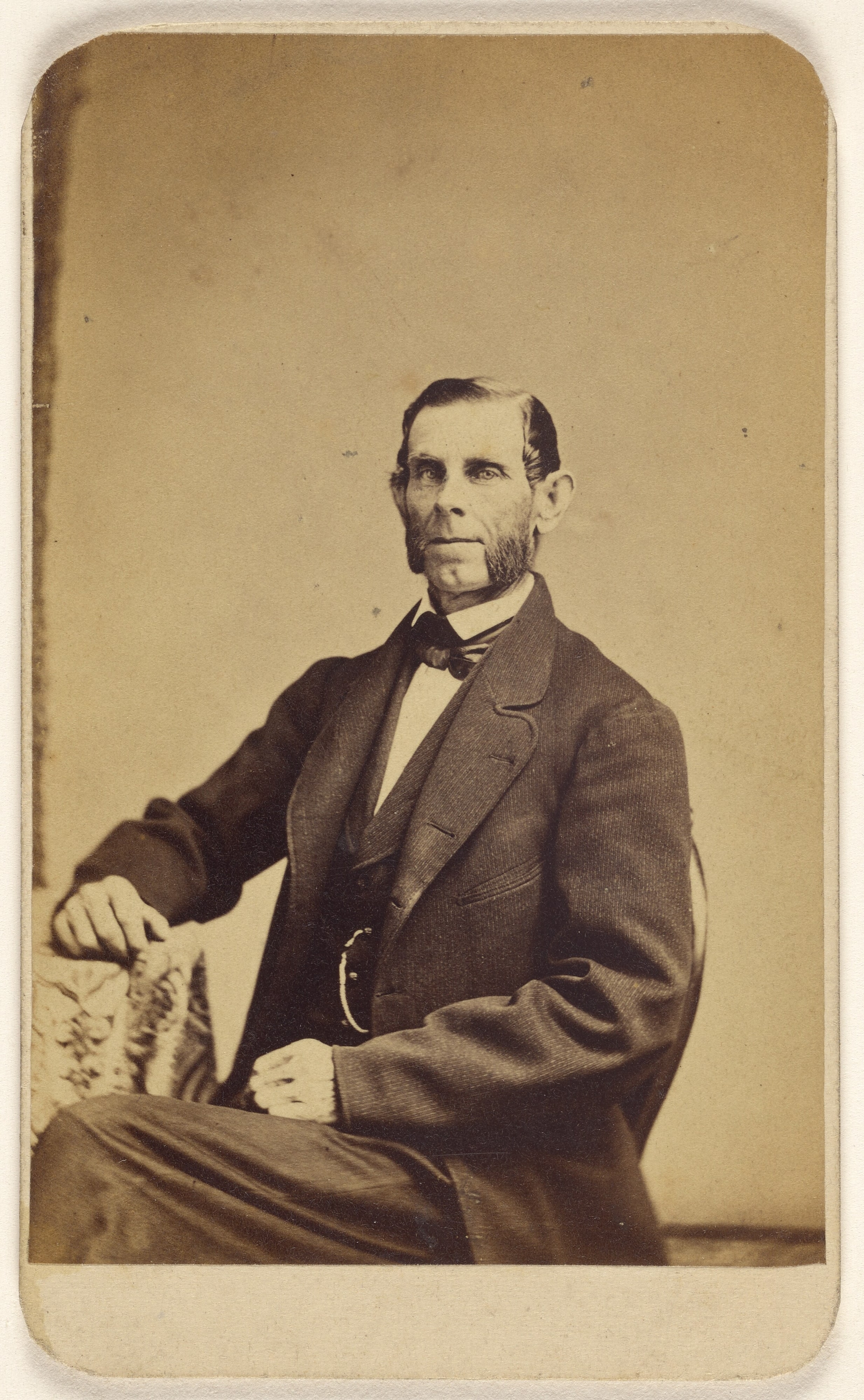 [Unidentified man with full muttonchops, seated]