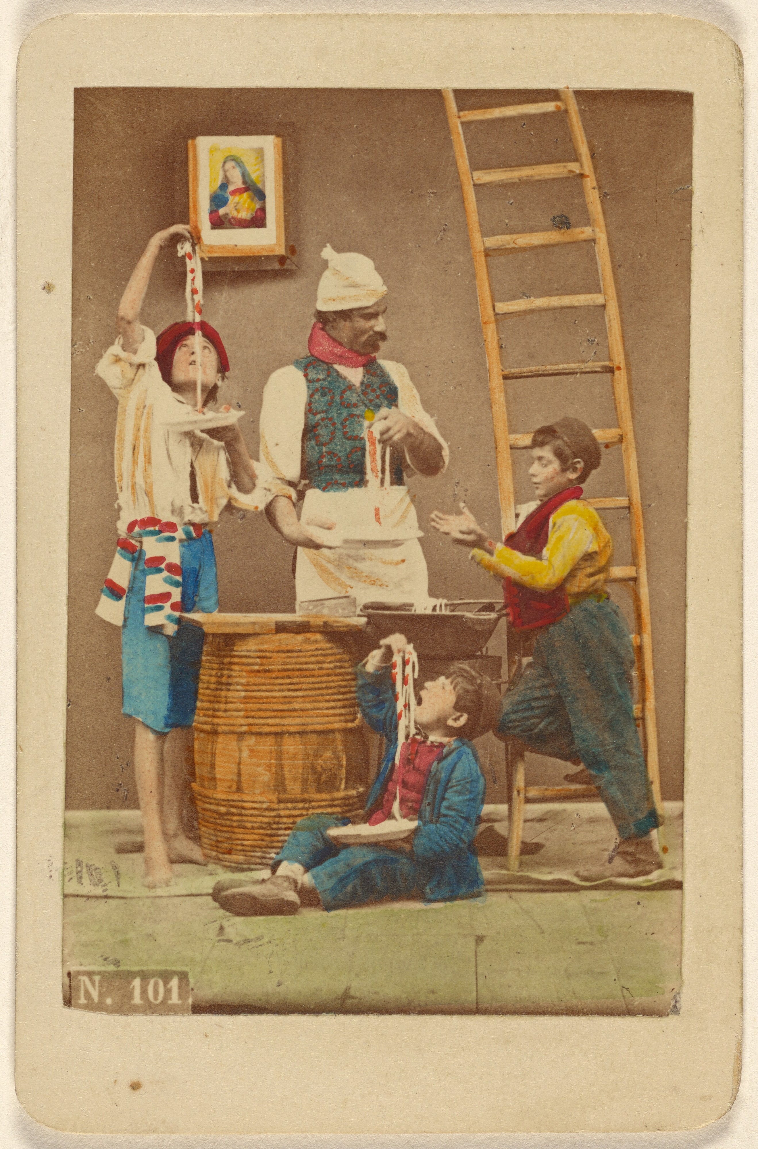 [Unidentified man with moustache making pasta, three boys either eating it or helping him make it]