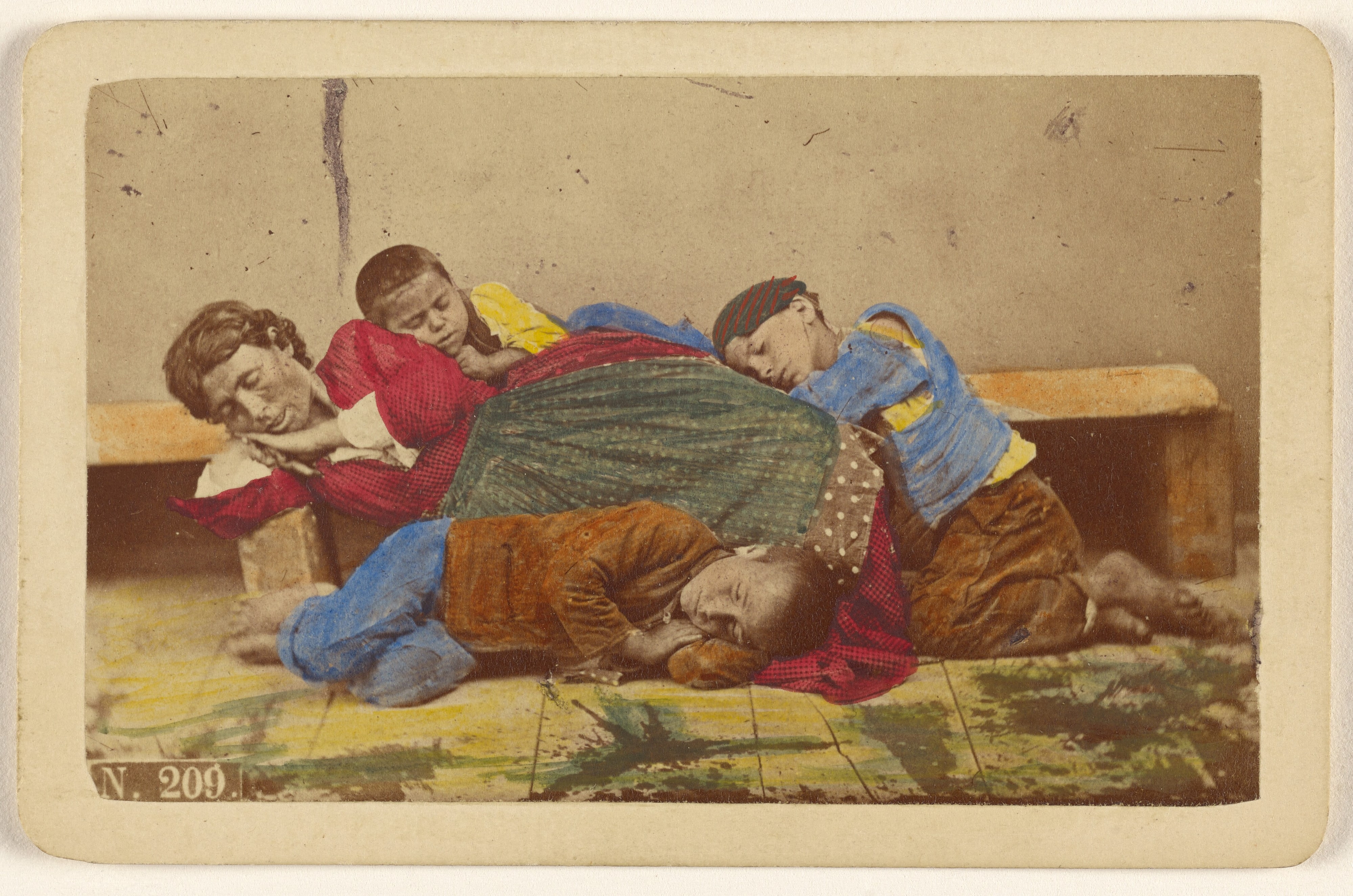 [Gypsy mother and three children alseep on bench and ground]