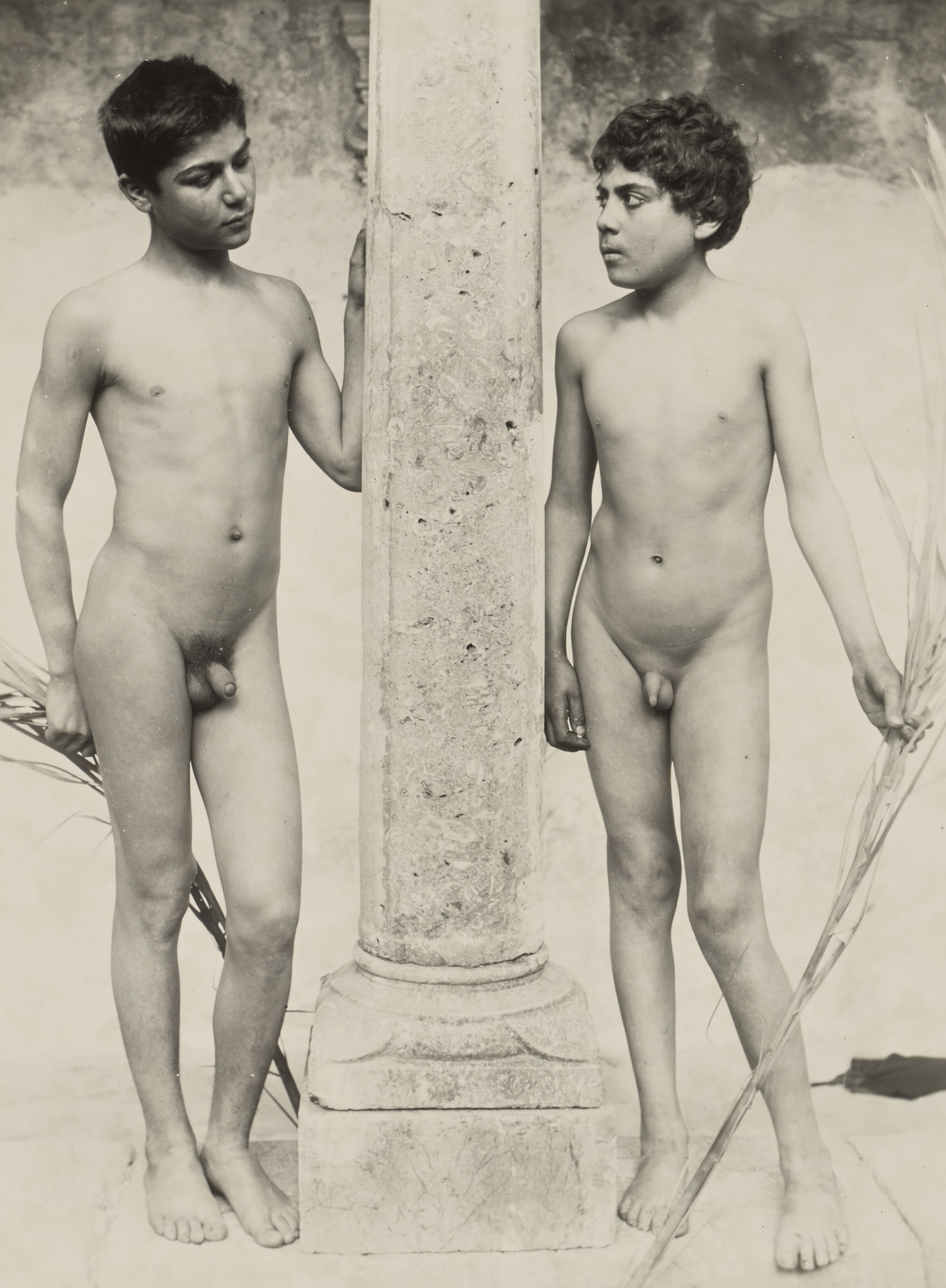 [Two boys with column]