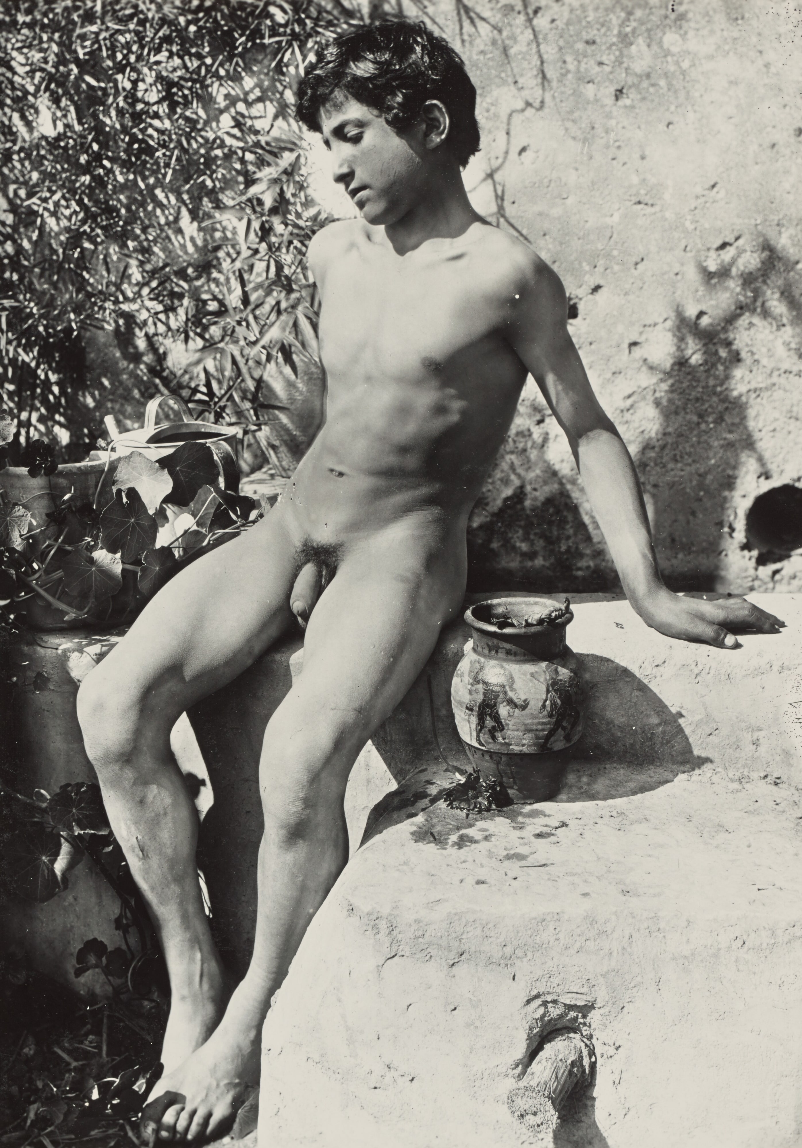 [Nude youth in garden]