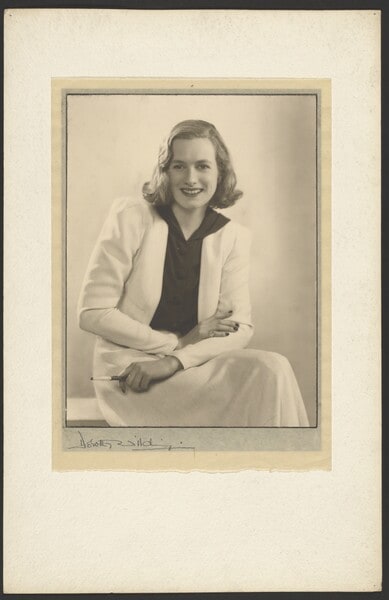 [Portrait of woman in white coat]