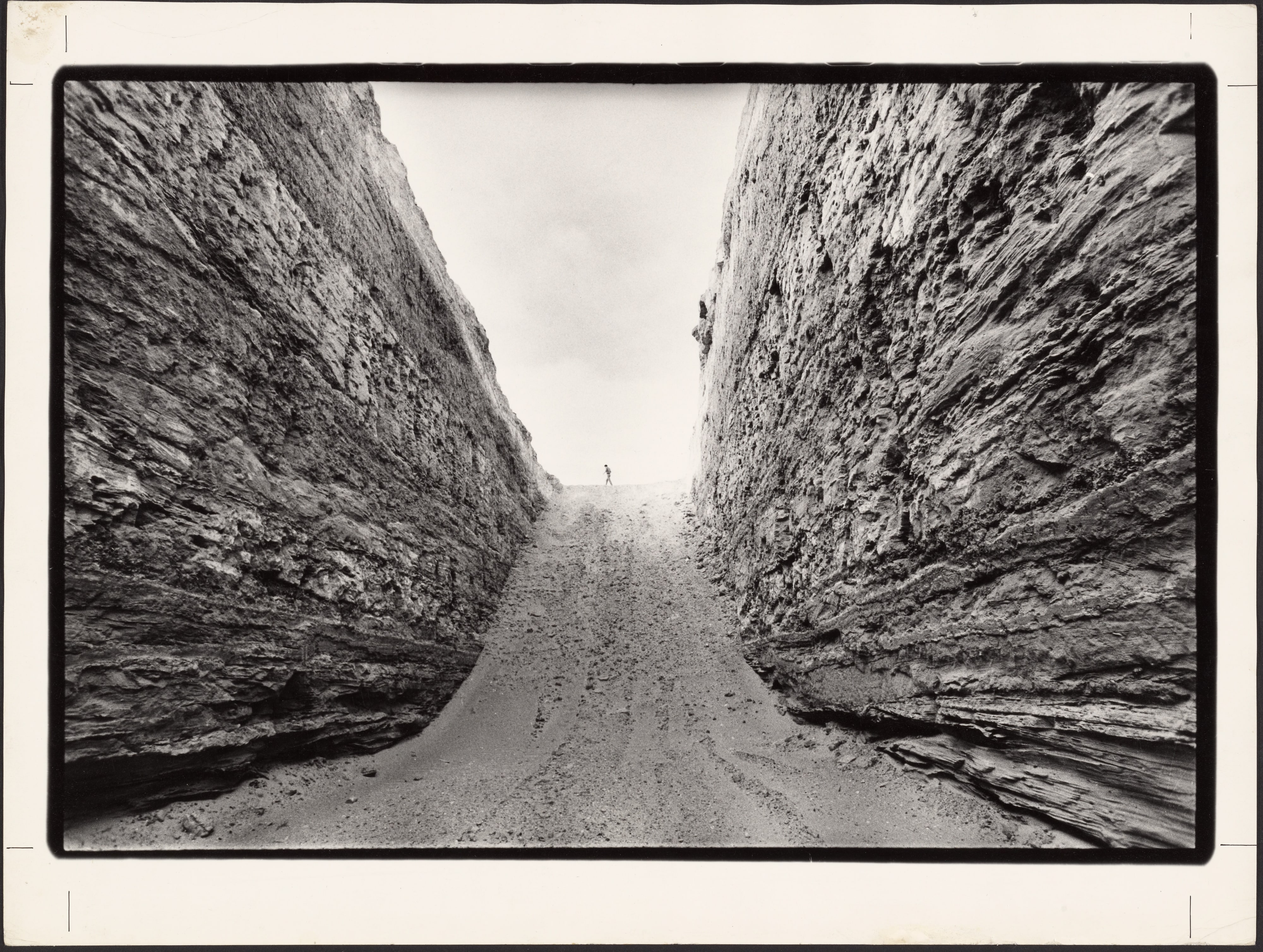 Michael Heizer standing on Double Negative, North Las Vegas, Nevada