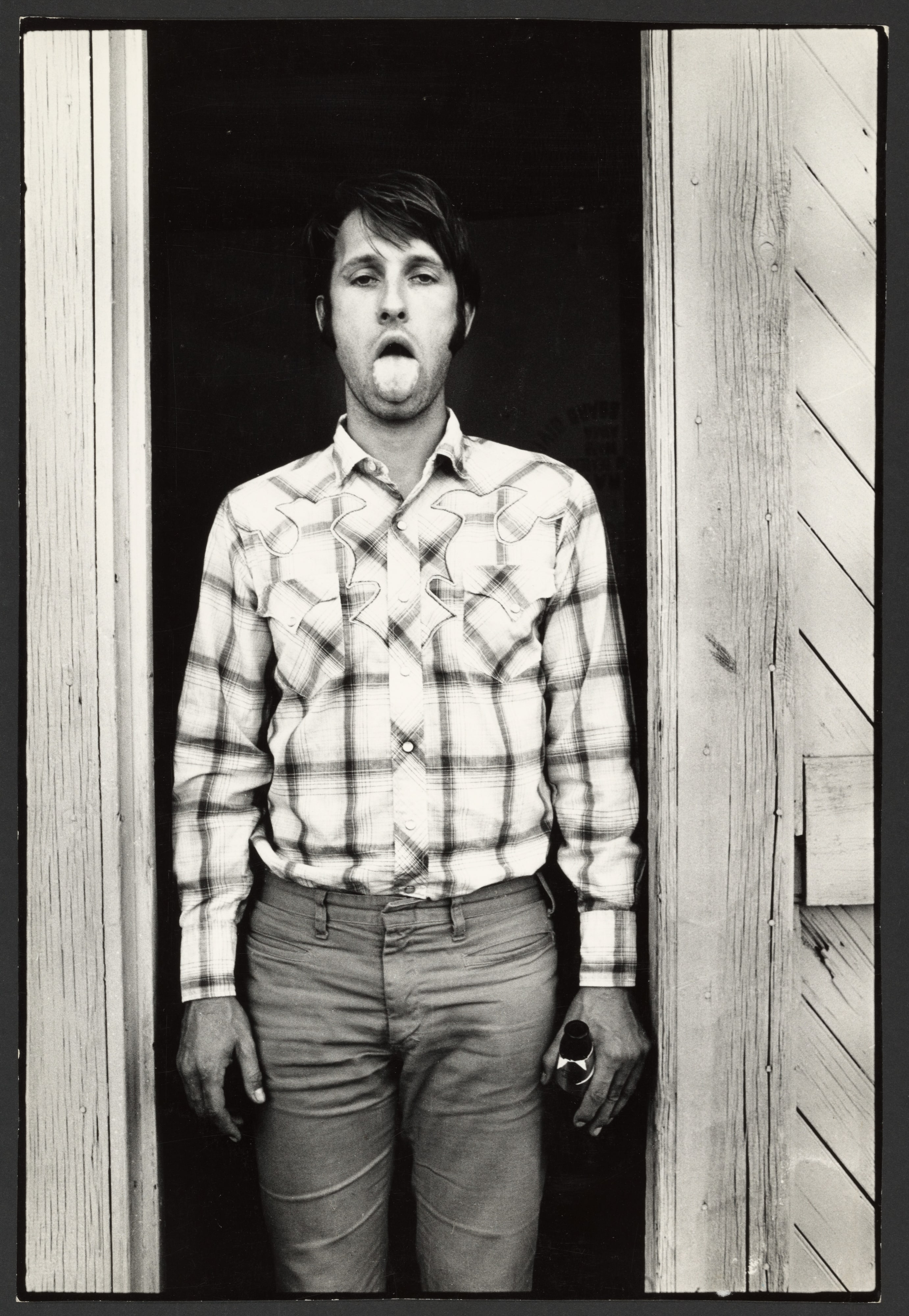Bruce Nauman showing his tongue