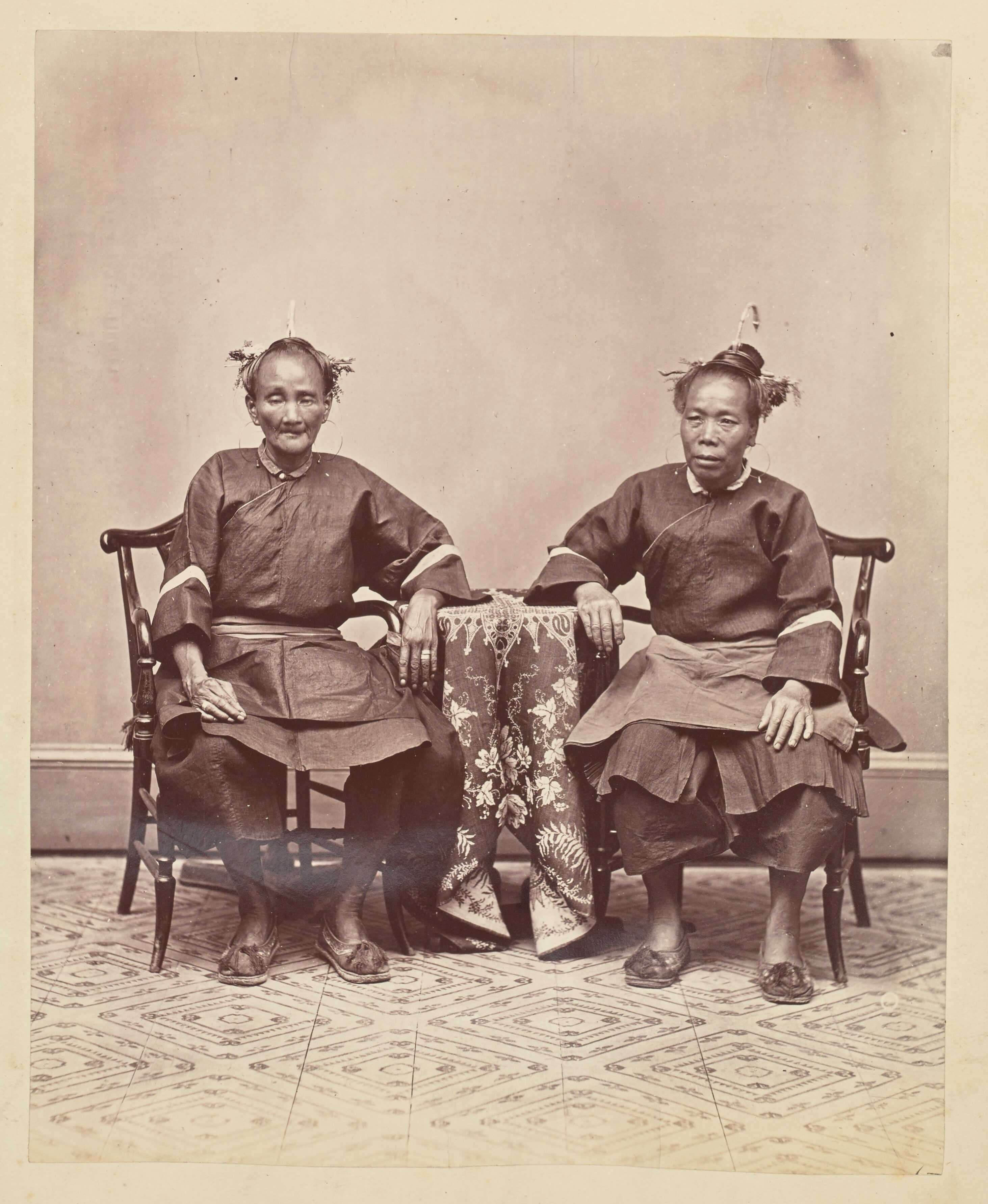 [A studio portrait of two seated field Foochow women]