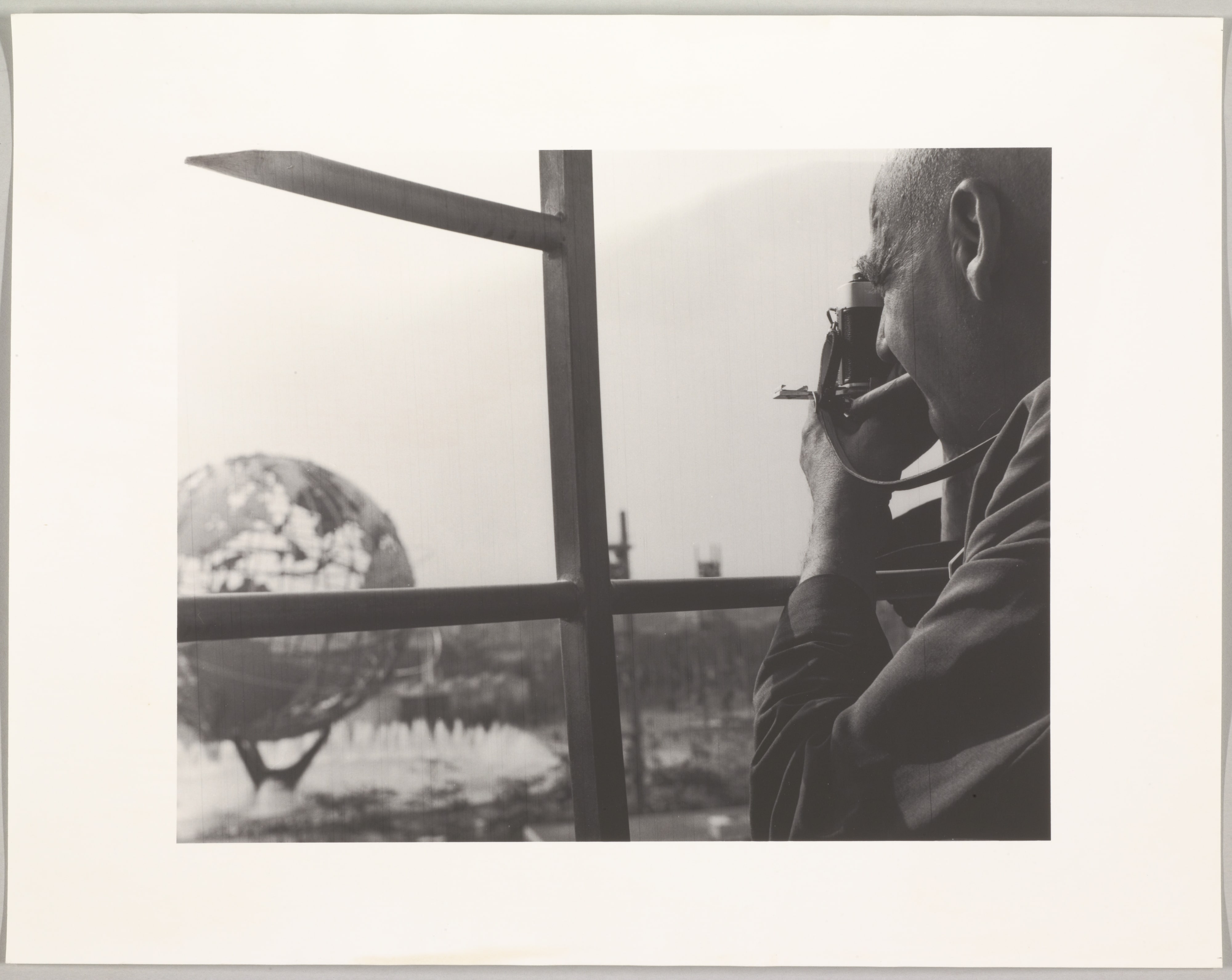 Weegee Taking Picture of Globe, World's Trade Fair