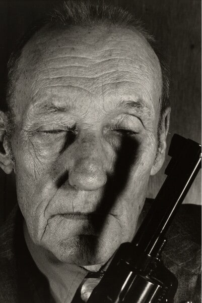 William S. Burroughs (with gun and eyes closed), Lawrence, Kansas