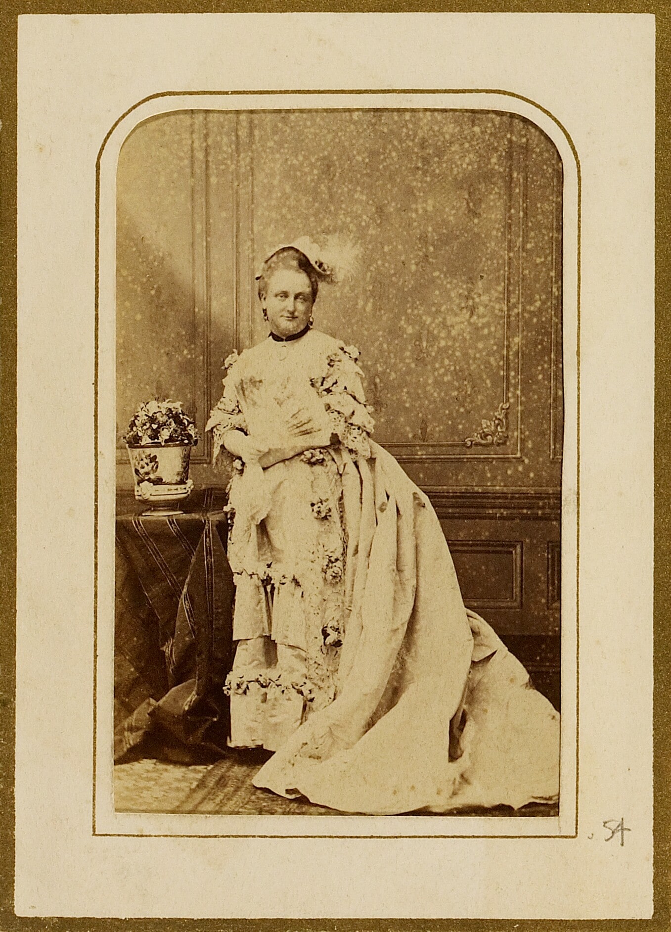[Portrait of a woman holding a fan]