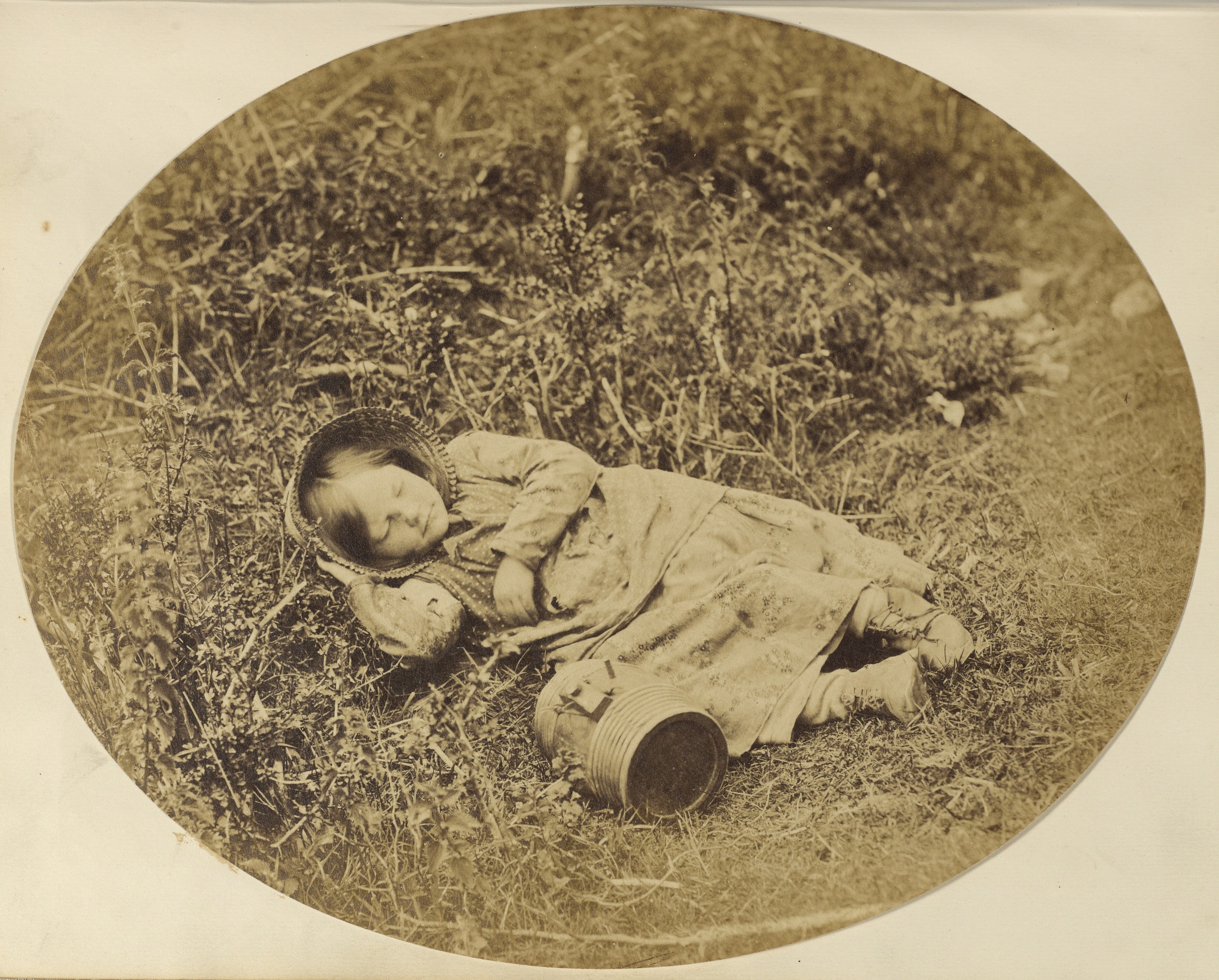 [Girl sleeping in grass]