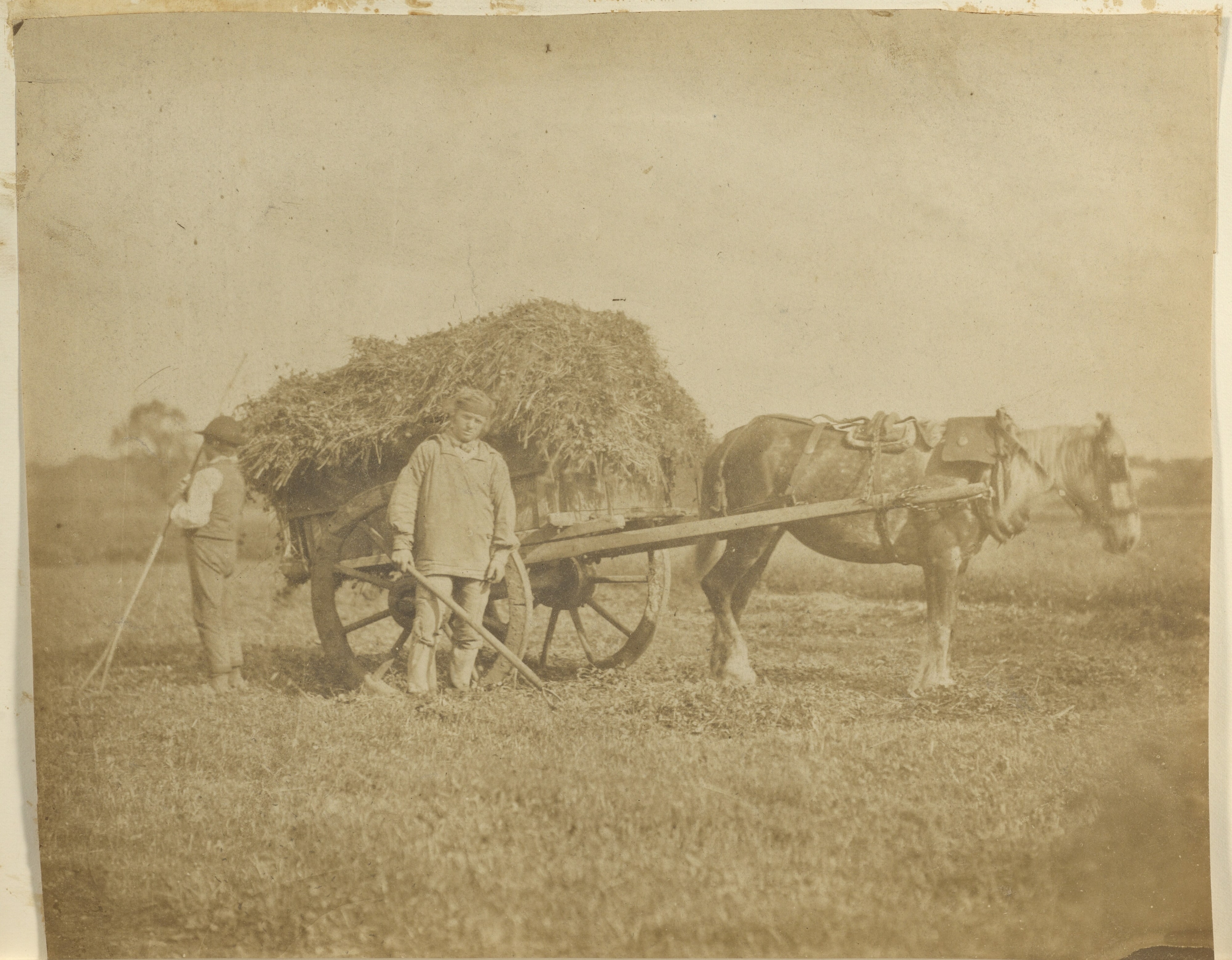[Man and boy with cart]