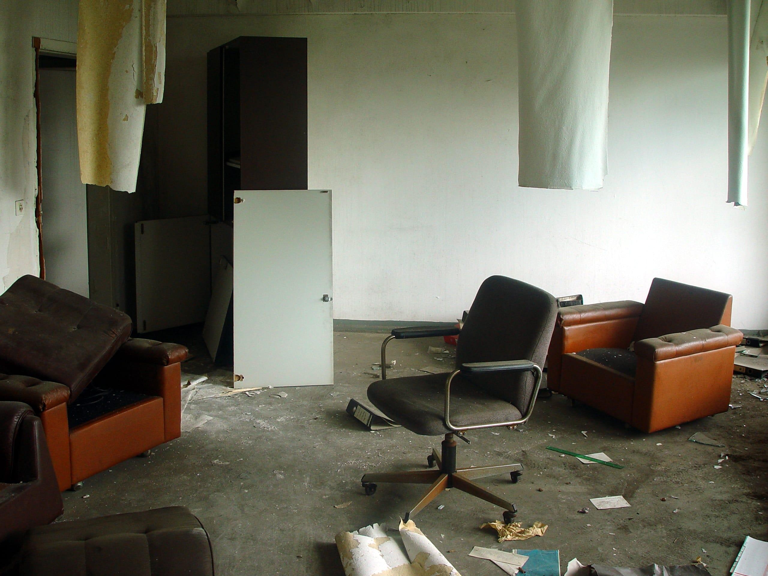 Untitled (three chairs w/ fabric hanging from ceiling)